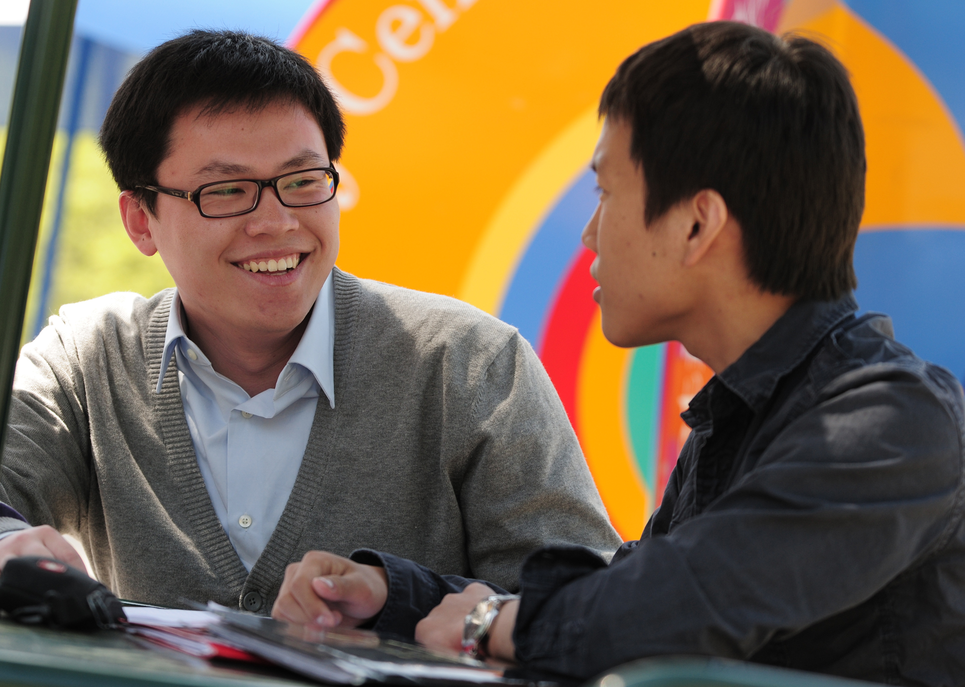 SUNY Stony Brook University College of Business International Students Talking at a Table