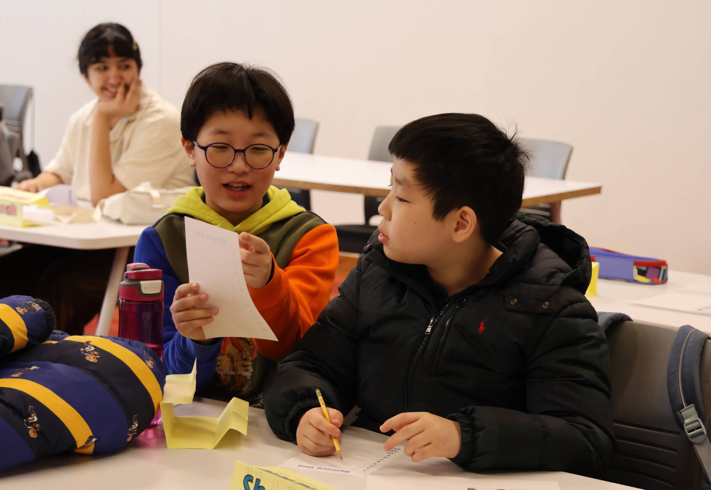 An ICPS participant taking diligent notes during class