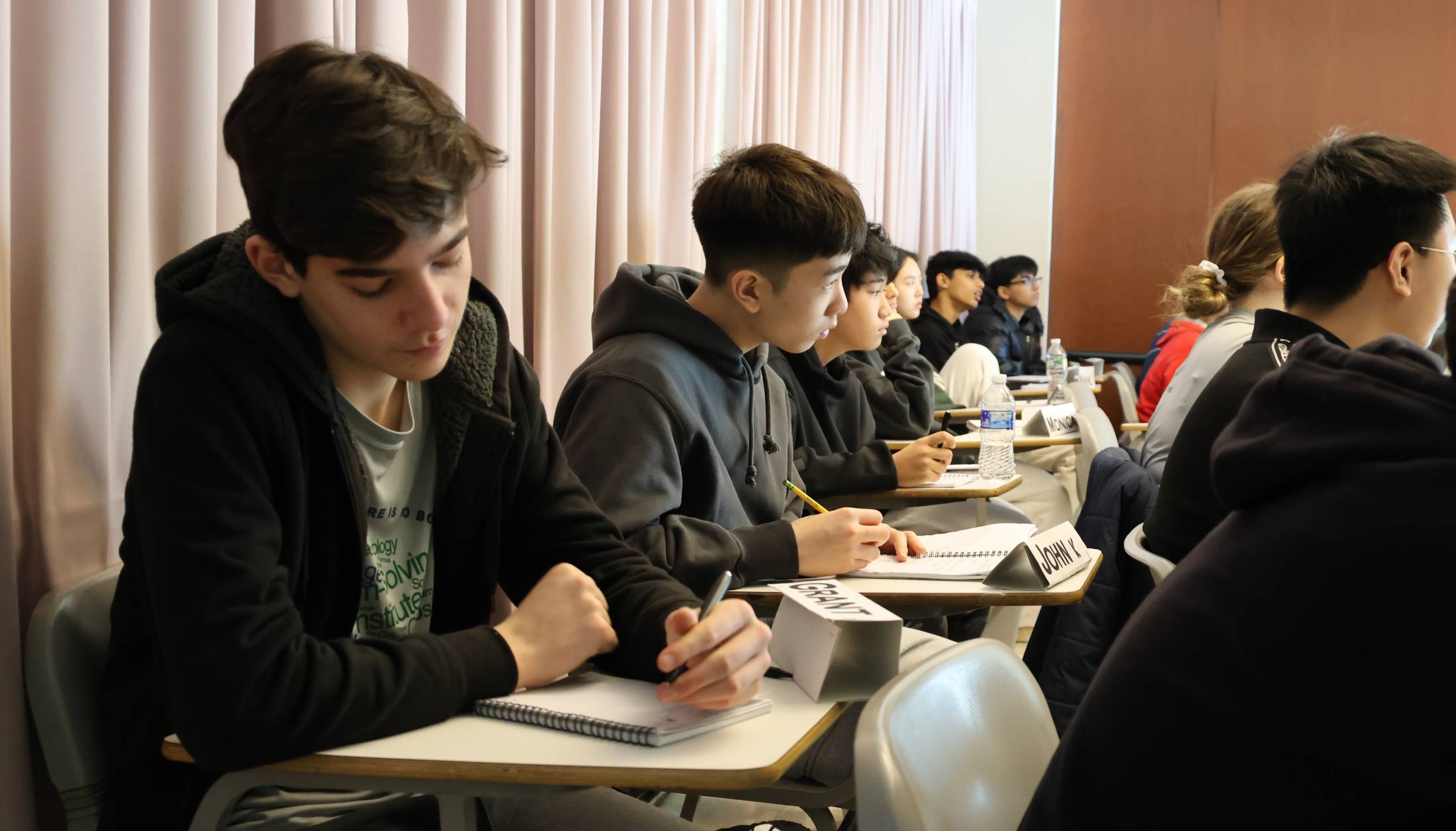 Ninth and tenth graders in class at ICPS