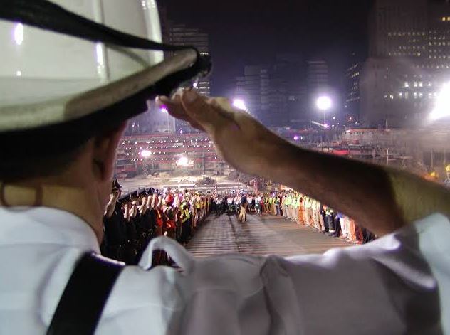 Man saluting at nine eleven site.